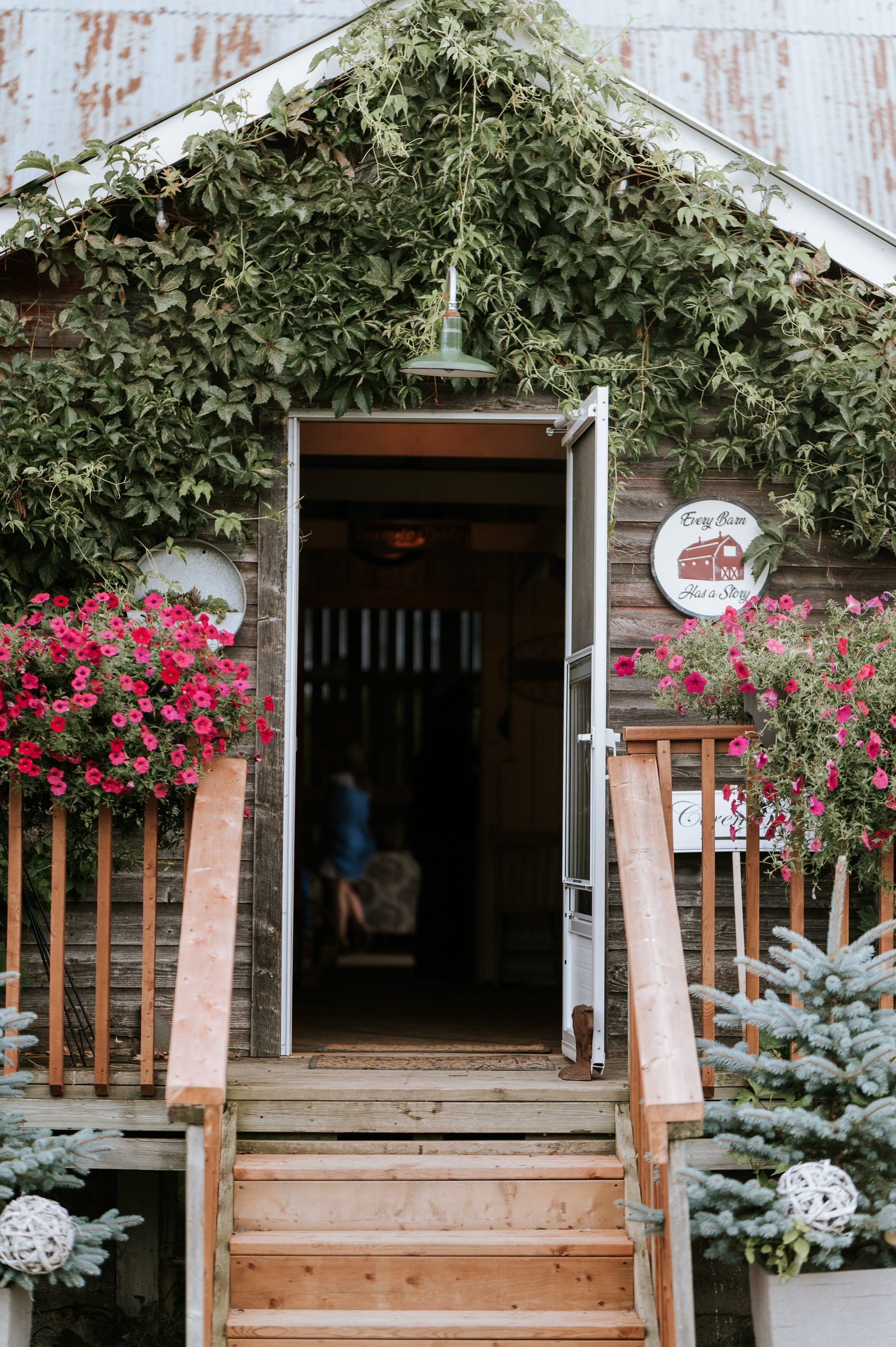 The Fry Shack entrance with ivy, pink flowers, and welcoming steps
